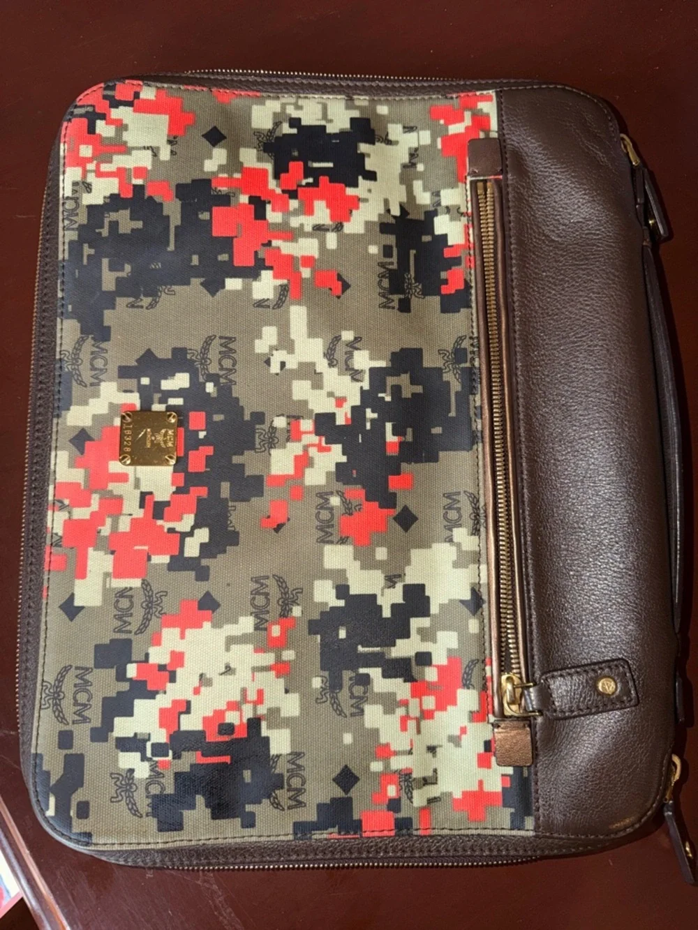 MCM laptop portfolio with brown leather trim and digital camo fabric